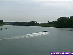Lesbian licked and fingered her clit on boat