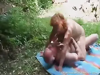 Mature Redhead Tart With Huge Tits Fucked Doggy In The Bushes